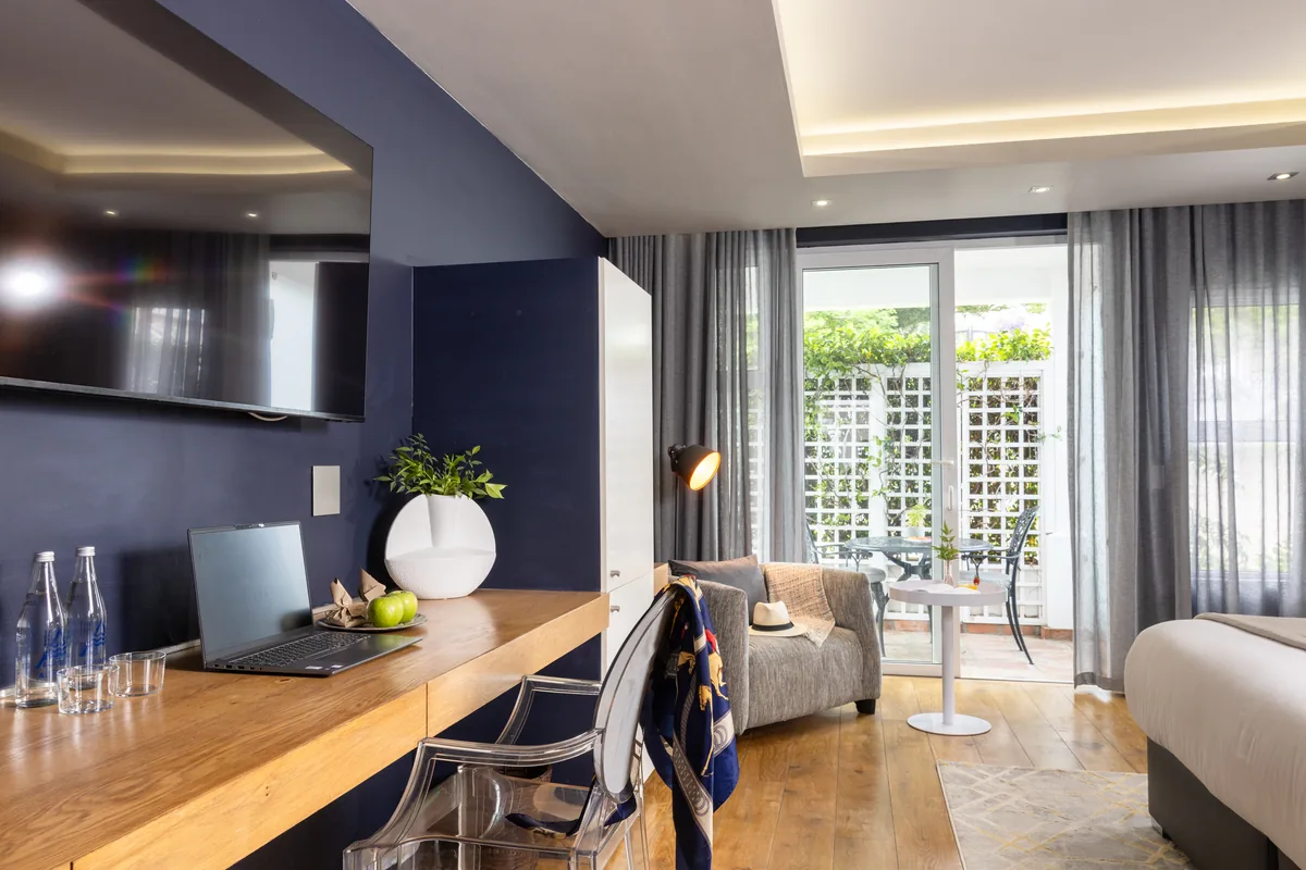 Deluxe Room desk and sitting area at Majeka House Boutique Hotel